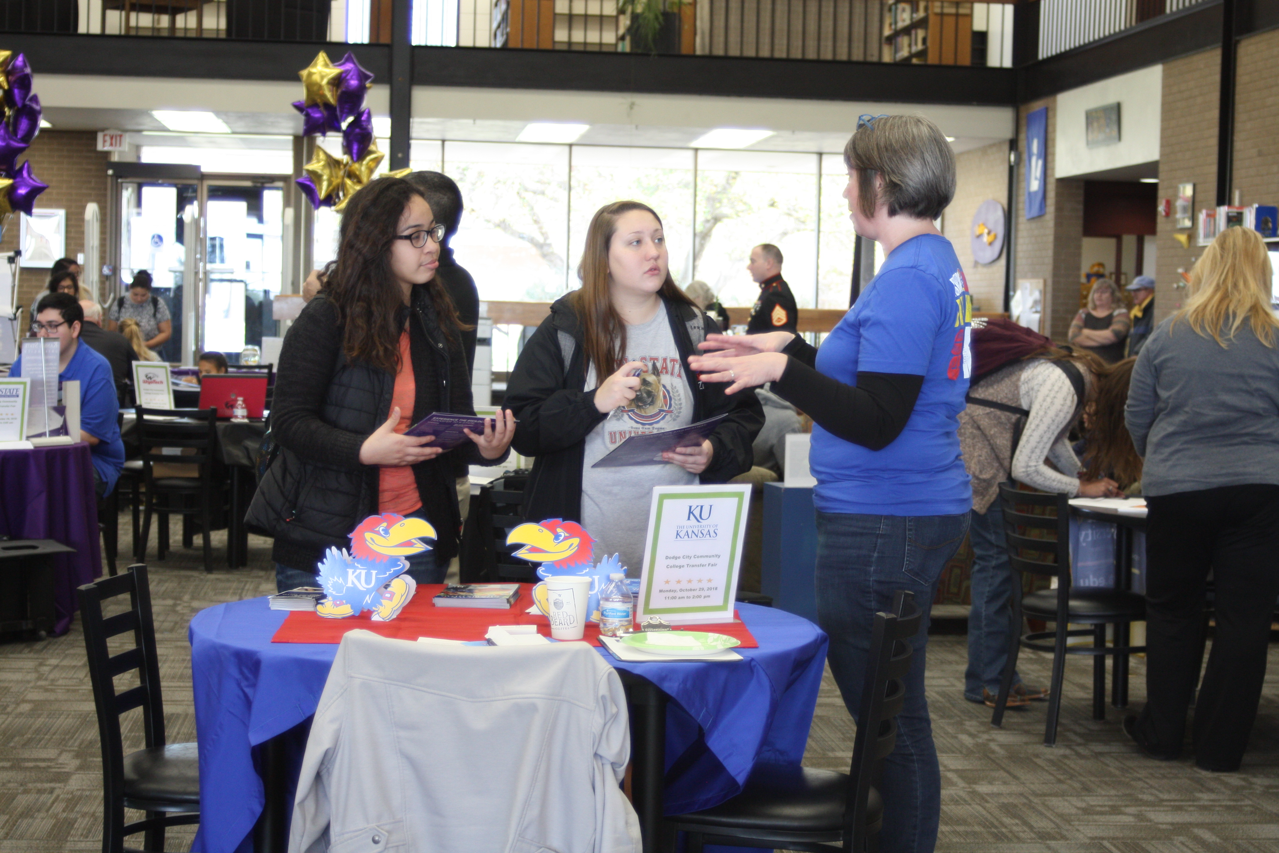 DC3 students meet with a KU representative, one of the 19 colleges from four states present at the transfer fair.