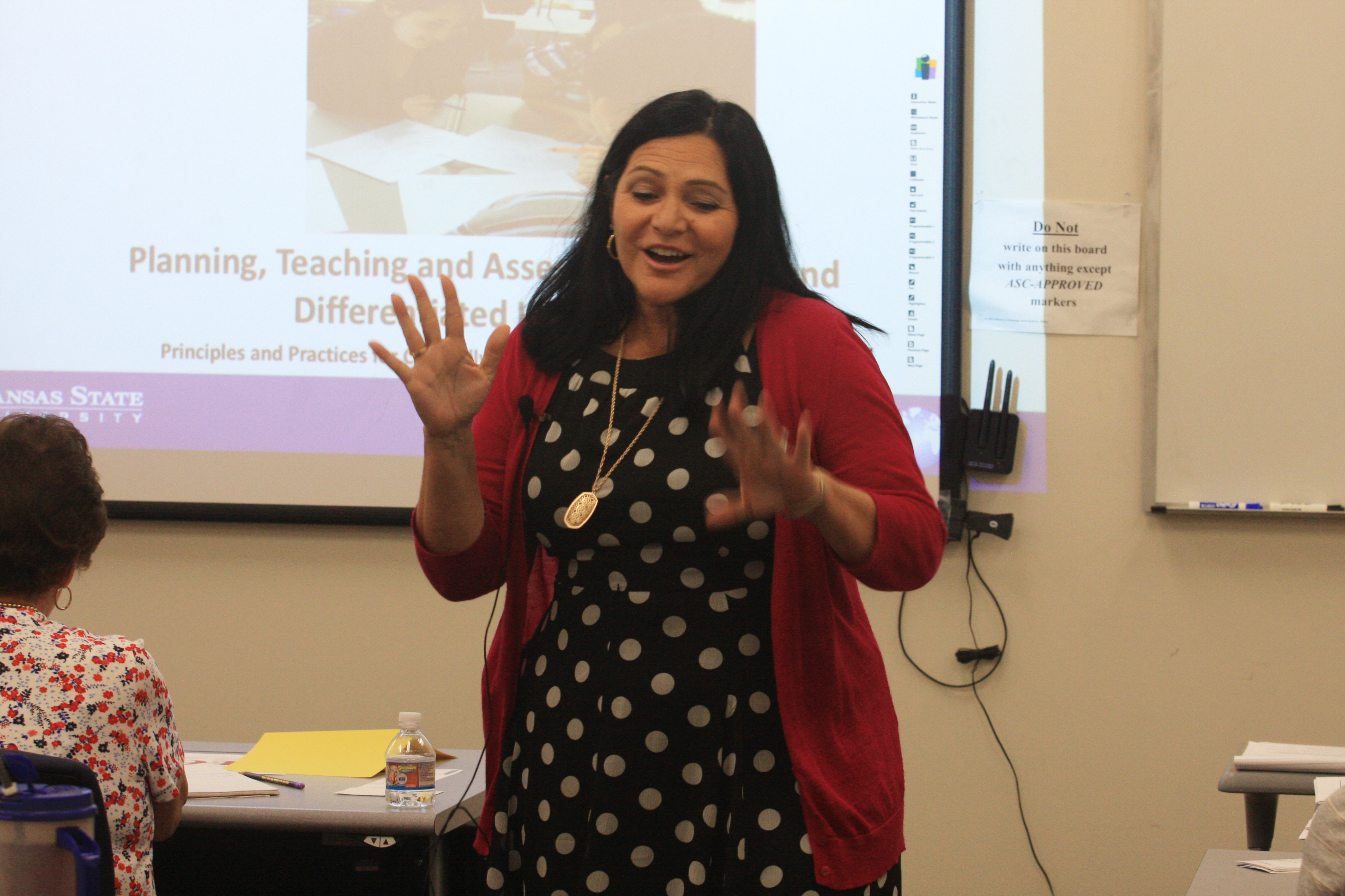 Dr. Socorro Herrera presenting to faculty at DC3